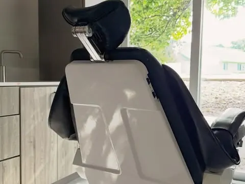 A treatment room at Pine Ridge Dental, the dental chair beside a bright window.